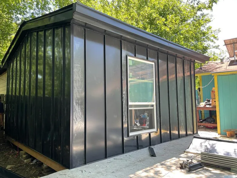 Black standing seam metal wall panels for Roof Inspection in Wilna